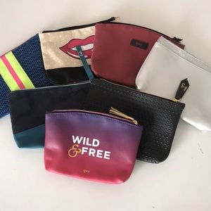 assortment of Ipsy bags